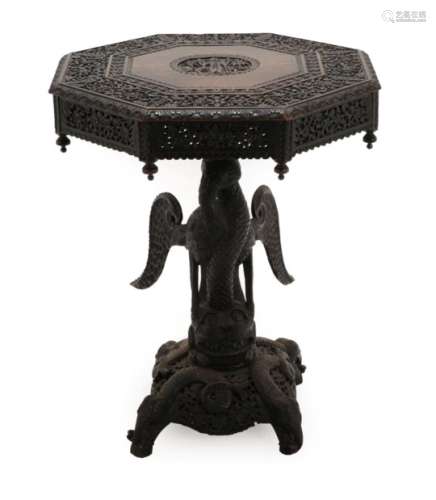 An Indian Hardwood Occasional Table, 19th century, the octagonal top centred by a figural panel