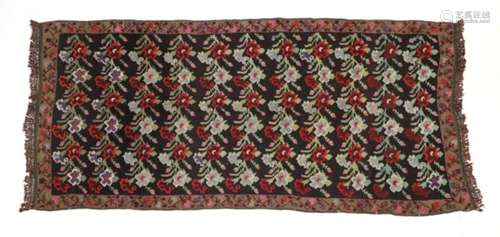 Karabagh Kilim South Caucasus, 20th century The charcoal field with polychrome stylised plants