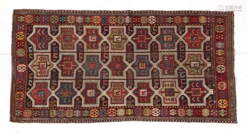 Karabagh Rug South Caucasus, circa 1900 The charcoal field with three columns of linked heraldic