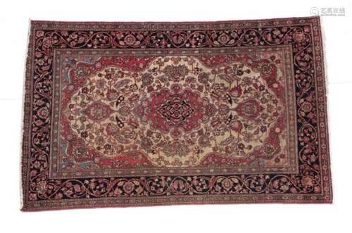 Isfahan Rug Central Iran, circa 1920 The cream field of vines around a pole medallion framed by