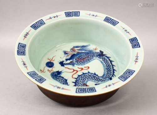 A 20TH CENTURY CHINESE BLUE & WHITE PORCELAIN DRAGON BOWL, the bowls interior decorated with