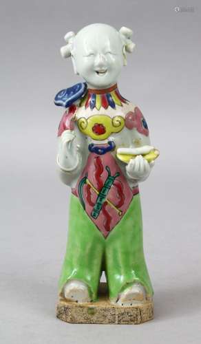 A 19TH CENTURY CHINESE FAMILLE ROSE PORCELAIN FIGURE, of a boy / actor holding a ruyi scepter, 19.