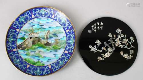 A 20TH CENTURY CHINESE CLOISONNE DISH, the dish depicting scenes of temples in landscapes, 23cm