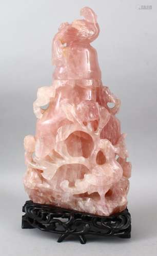 A LARGE 19TH CENTURY CHINESE ROSE QUARTZ VASE, COVER & STAND, the vase carved to depict scenes of