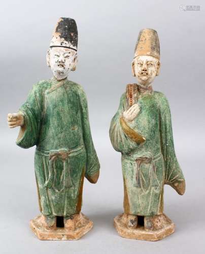 A PAIR OF 19TH CENTURY MING STYLE TERRACOTTA FIGURES OF MEN, the bodies with painted detailing, 35cm