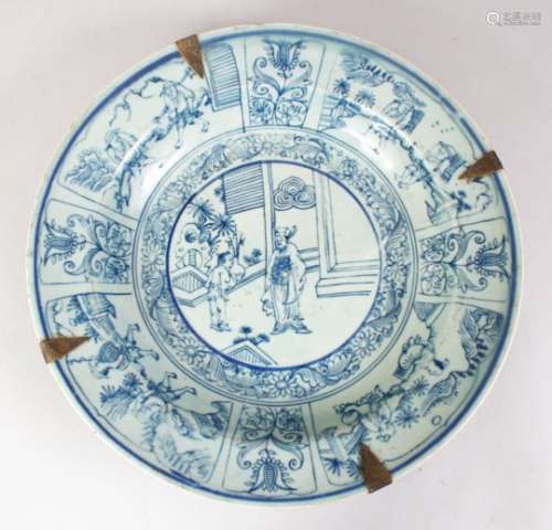 A GOOD 17TH CENTURY STYLE KRAAK BLUE & WHITE PORCELAIN DISH, decorated with scenes of figures in