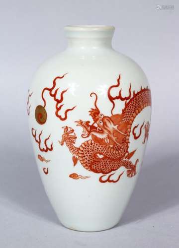 A 20TH CENTURY CHINESE IRON RED PORCELAIN DRAGON VASE, the body with a five claw dragon chasing