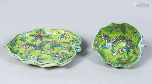 A 19TH CENTURY CHINESE GREEN GLAZED PORCELAIN DRAGON LOTUS CUP & SAUCER, the moulded cup and