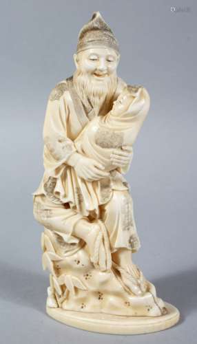 A GOOD JAPANESE MEIJI PERIOD CARVED IVORY OKIMONO OF MAN AN BABY, the man carved with a humorous