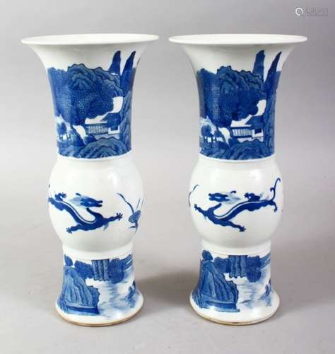 A PAIR OF CHINESE KANGXI STYLE BLUE & WHITE PORCELAIN VASES, the vases decorated with scenes of