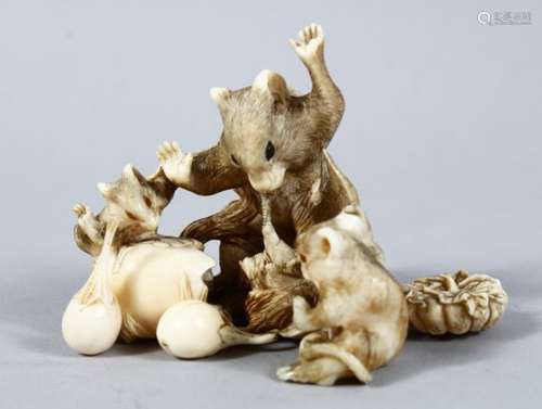 A GOOD JAPANESE MEIJI PERIOD CARVED IVORY OKIMONO - RAT GROUP, three rodents attacking a bird whom