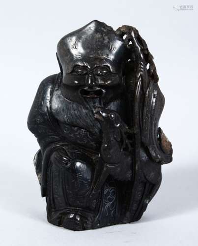 A 19TH / 20TH CENTURY CHINESE CARVED HARDSTONE FIGURE OF TAOIST GOD JUROJIN, seated with a deer to