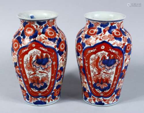 A GOOD PAIR OF 19TH CENTURY JAPANESE IMARI VASES, both vases decorated in typical imari palate