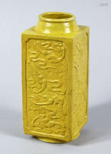 A CHINESE REPUBLIC PERIOD YELLOW GLAZED MOULDED CONG VASE, each section of the square form vase with