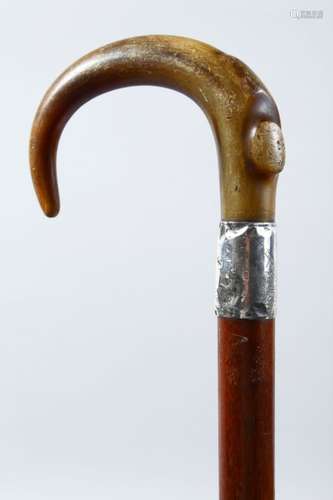 A GOOD 19TH CENTURY HORN HANDLED SILVER MOUNTED WALKING STICK, possibly rhino horn, 88.5cm high.