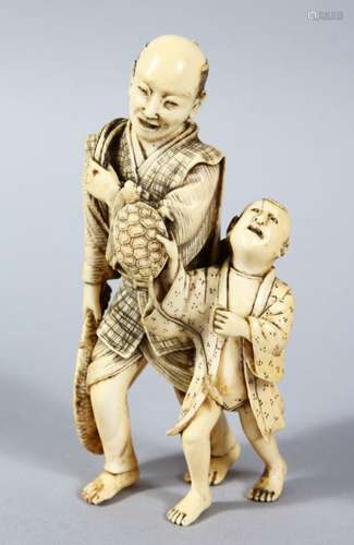 A GOOD JAPANESE MEIJI PERIOD CARVED IVORY FIGURE OF MAN & BOY, the man stood holding a large catch