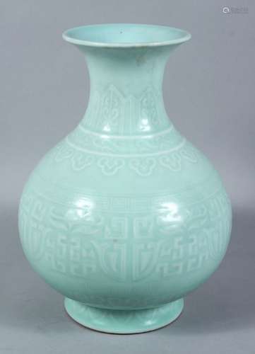 A GOOD CHINESE CELADON MOULDED PORCELAIN VASE, the body of the vase with moulded decoration in