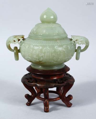 A CHINESE CARVED CELADON JADE LIDDED CENSER & STAND, the censer with carved lion mas handles and