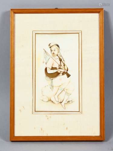 A GOOD 19TH CENTURY INDIAN PAINTED IVORY PICTURE, depicting a seated man playing a musical