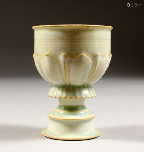 A GOOD CHINESE YUAN STYLE HUTIAN WARE WINE CUP, the body with moulded decoration, 9cm high x 6.7cm.