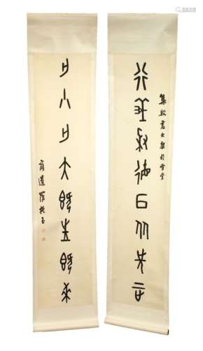 A GOOD PAIR OF 19TH CENTURY CHINESE HANGING CALLIGRAPHY SCROLLS, each scroll with painted