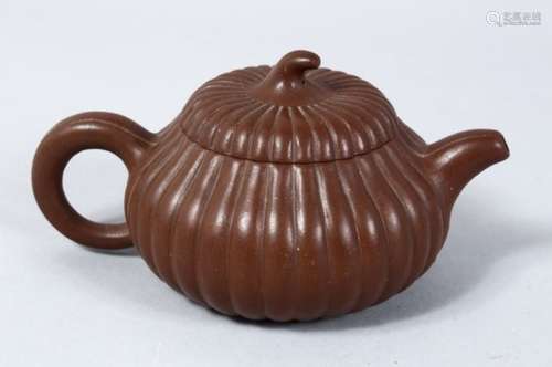 A GOOD 20TH CENTURY CHINESE YIXING CLAY TEAPOT, the teapot in moulded form of a pumpkin, the base