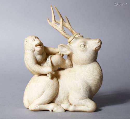 A LOVELY QUALITY JAPANESE MEIJI PERIOD CARVED IVORY OKIMONO - STAG AND MONKEY, the stag in a