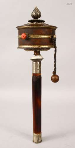 A 19TH CENTURY TIBETAN PRAYER WHEEL, the rotating wheel bound with leather and white metal mounts