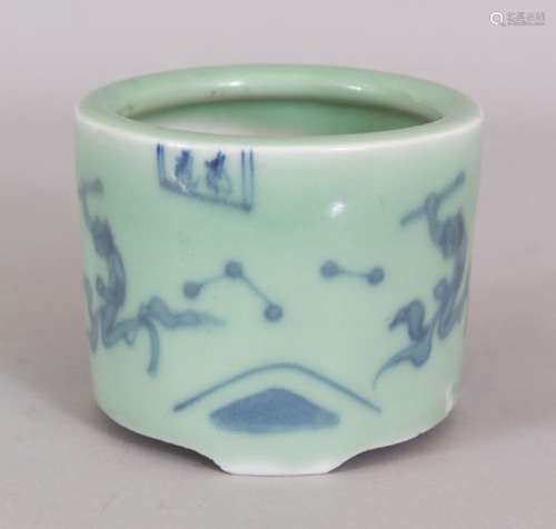 AN ORIENTAL UNDERGLAZE-BLUE & CELADON PORCELAIN TRIPOD CENSER, painted with small panels of