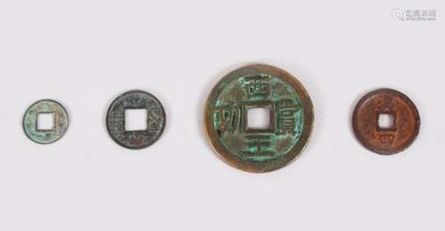 A COLLECTION OF FOUR ANCIENT CHINESE COINS, one xin dynasty, one wu chu, one southern song dynasty