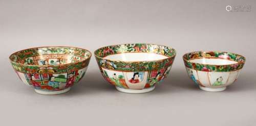 THREE 19TH CENTURY CHINESE CANTON FAMILLE ROSE PORCELAIN BOWLS, each similarly decorated with panels