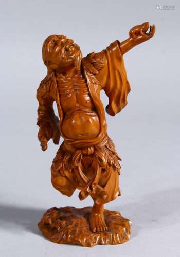 A GOOD JAPANESE LATE MEIJI PERIOD CARVED WOODEN OKIMONO OF GAMA SENIN, the okimono realistically