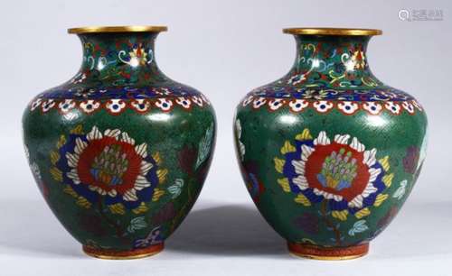 A PAIR OF 19TH / 20TH CENTURY CHINESE CLOISONNE VASES, the vases with a green ground and decorated