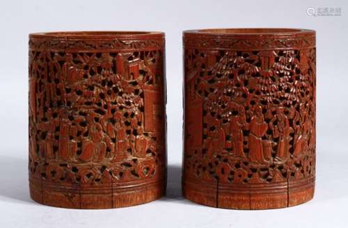 A GOOD PAIR OF 19TH CENTURY CHINESE CANTON CARVED WOOD BRUSH POTS / WASHERS, the pots carved with