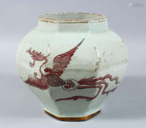 A CHINESE IRON RED DECORATED OCTAGONAL PORCELAIN JAR, the body of the jar decorated in iron red to