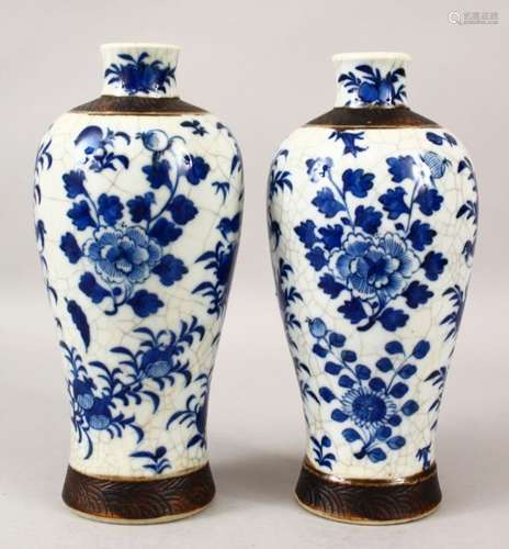 A PAIR OF 19TH CENTURY CHINESE BLUE & WHITE CRACKLE GLAZED PORCELAIN VASES, the body of the vases