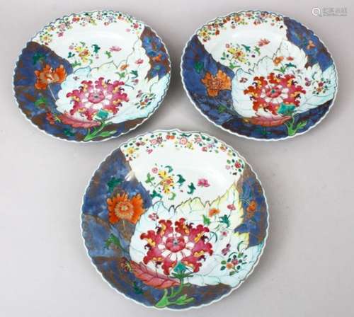 THREE 18TH CENTURY CHINESE FAMILLE ROSE PORCELAIN PLATES, decorated with an array of colours