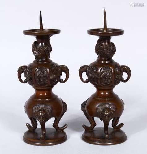 A PAIR OF 19TH CENTURY JAPANESE BRONZE ALTER PRICKET'S, with moulded elephant handles and feet, with