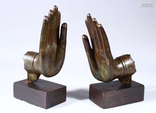 A PAIR OF EARLY CHINESE BRONZE HANDS FROM A FIGURE OF BUDDHA / GUANYIN, the pair of hands mounted to