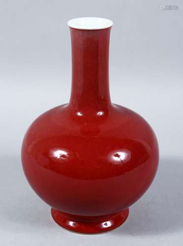 A 19TH / 20TH CENTURY CHINESE RED GLAZED PORCELAIN BOTTLE VASE, the base bearing a six character