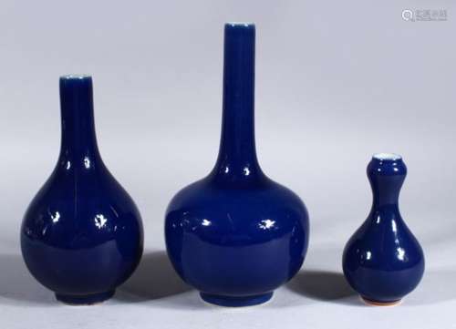 THREE 19TH / 20TH CENTURY CHINESE POWDER BLUE PORCELAIN BOTTLE VASES, 22cm high, 18.5cm & 12cm