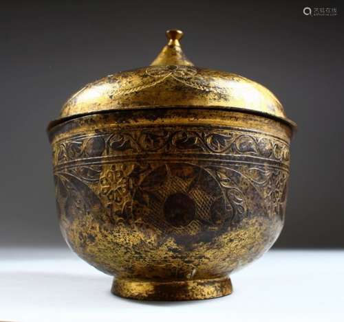 AN 18TH CENTURY TURKISH OTTOMAN GILDED COPPER 'TOMBAK' LIDDED BOWL, engraved with stylised foliage