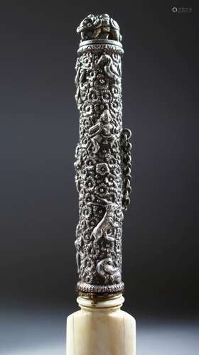 A 19TH CENTURY SOUTH INDIAN IVORY PAGE TURNER, the silver handle chased and embossed with flowers,