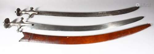 A 19TH CENTURY INDIAN TULWAR, with steel hilt and leather scabbard, together with a similar sword