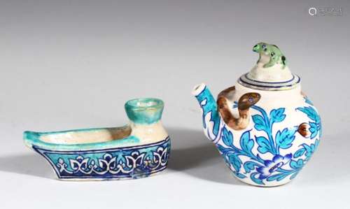 A FINE 19TH CENTURY GLAZED POTTERY BOAT SHAPED OIL LAMP, together with a similar ewer and cover,