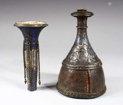 A ENGRAVED SILVER AND ENAMEL DECORATED HUQQA BASE, in three parts, the base engraved with panels