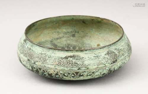 A SELJUK BRONZE CIRCULAR BOWL, with engraved decoration, 16cm diameter.