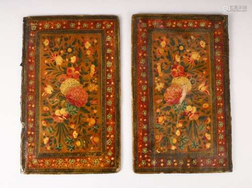 A PAIR OF QAJAR PAINTED LACQUER BOOK COVERS, 23cm x 14.5cm.