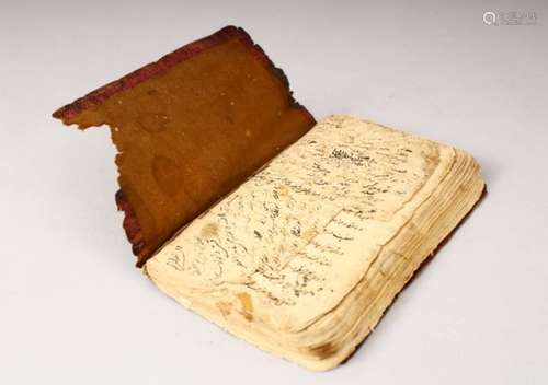 AN EARLY LEATHER BOUND ISLAMIC BOOK ON ASTRONOMY, 16cm x 11cm.