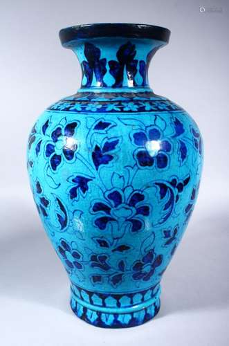 A LARGE INDIAN POTTERY VASE, with turquoise glaze and stylised floral decoration, 42cm high.